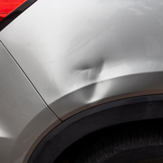 car side panel dent with visible damage repair options for 7 types of dents